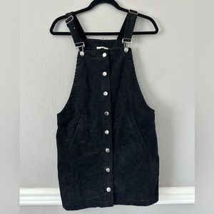Black corduroy button up overalls